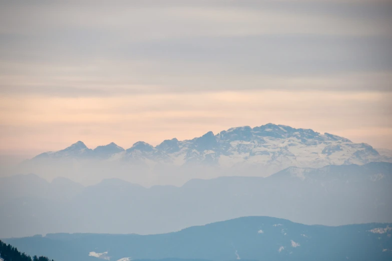 a view of the mountains from a hill