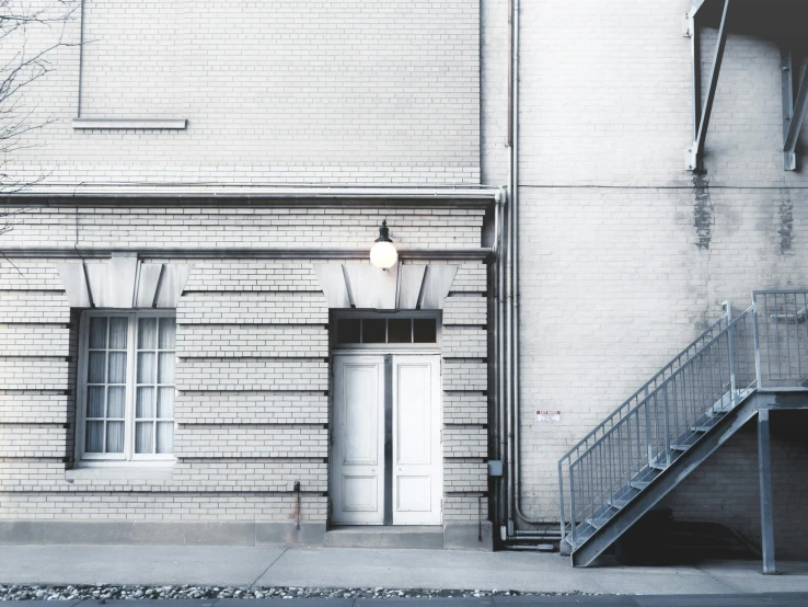 the entrance to a building with a ramp in front of it