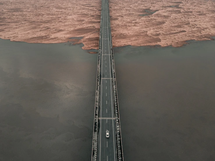 a long bridge in the middle of water