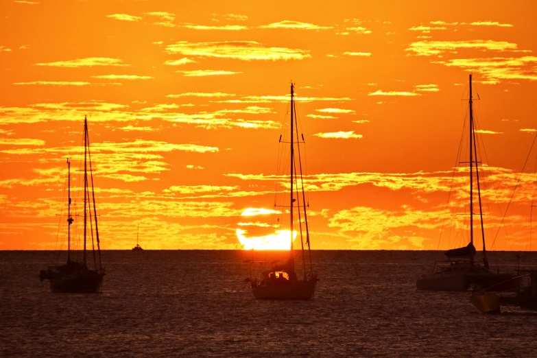 a large group of boats that are floating in the water