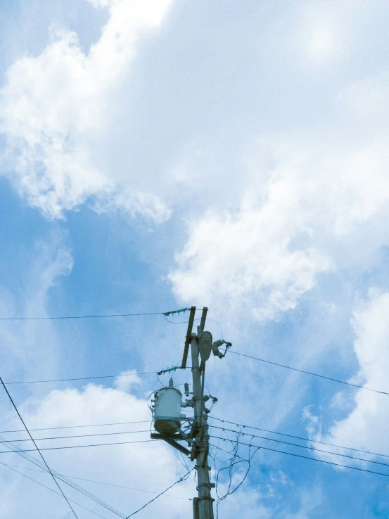 a sky view of the top of a telephone pole