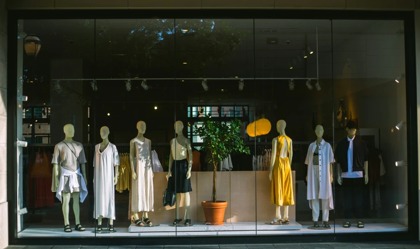 a display in the window of a store displaying clothing