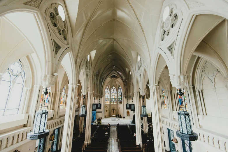 an inside of a church with several pews and a long table