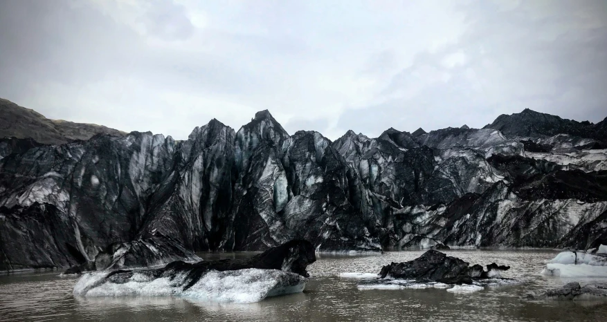 a mountain range sitting next to the ocean