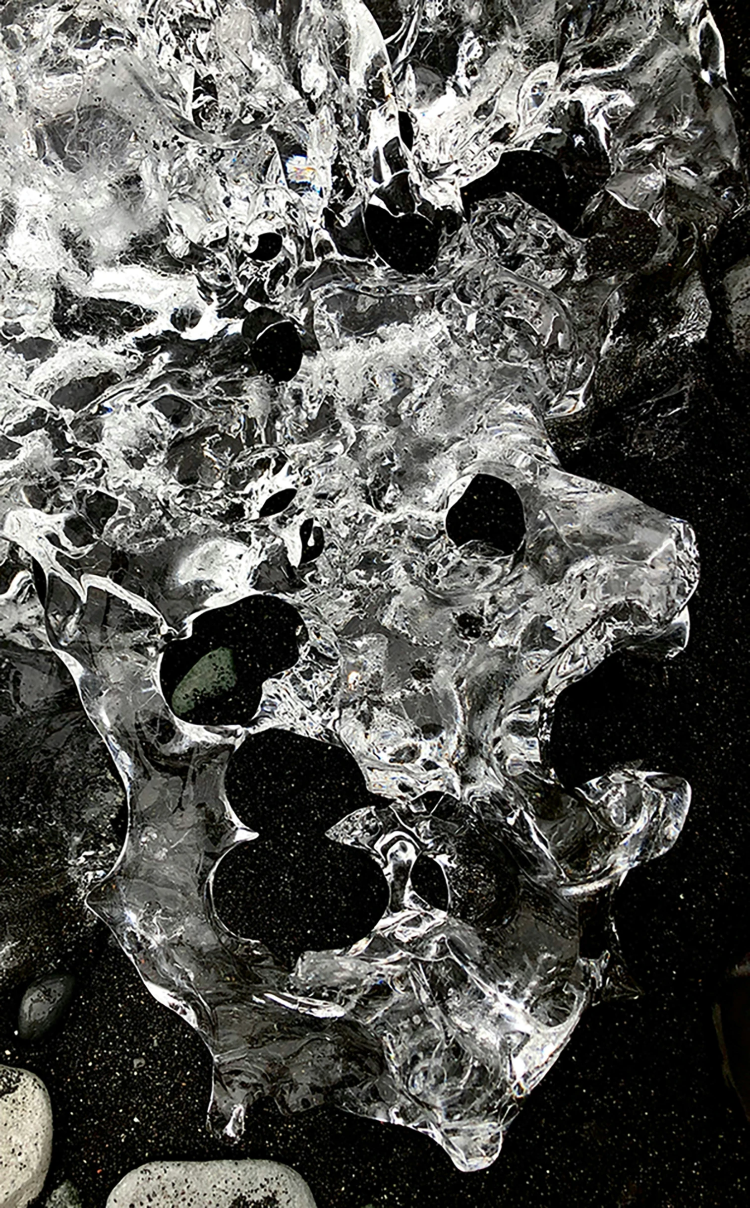 water being dropped in front of rocks on the ground