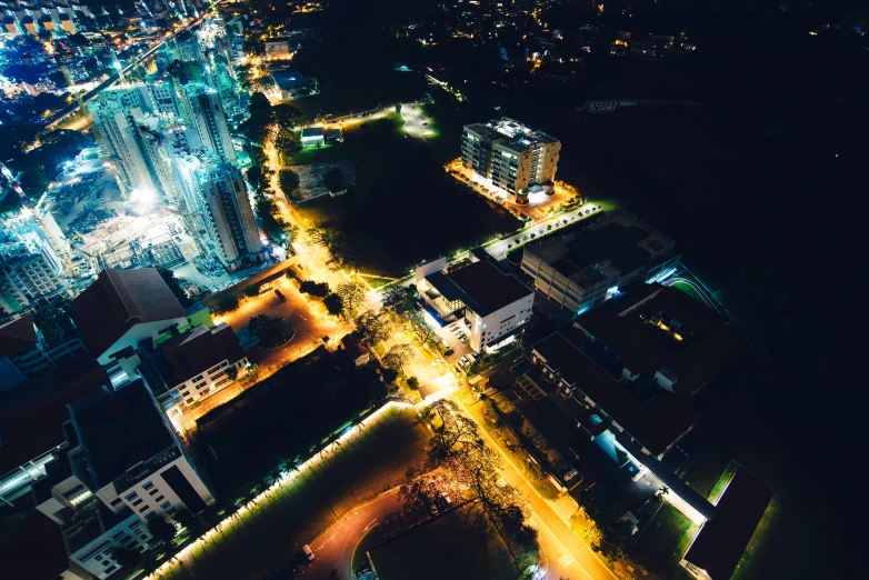 a city is lit up at night with brightly lit lights