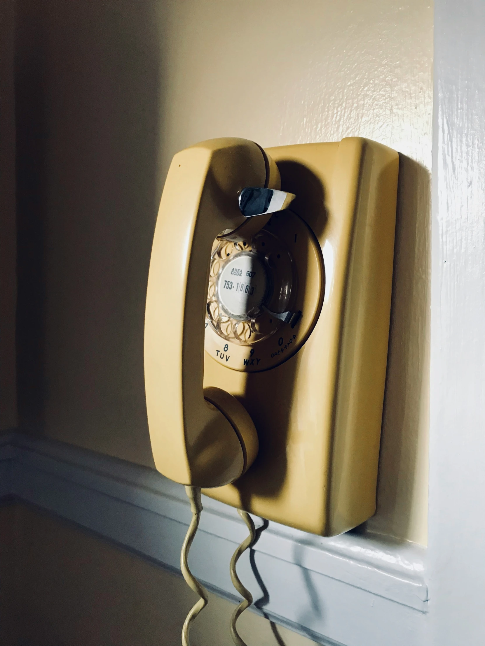 a telephone with a cord attached to it