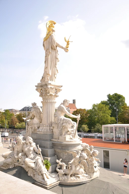 the statue in the park is surrounded by statues
