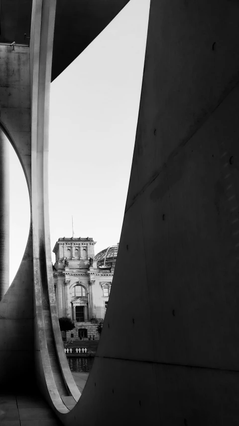 a view from behind some very large pillars