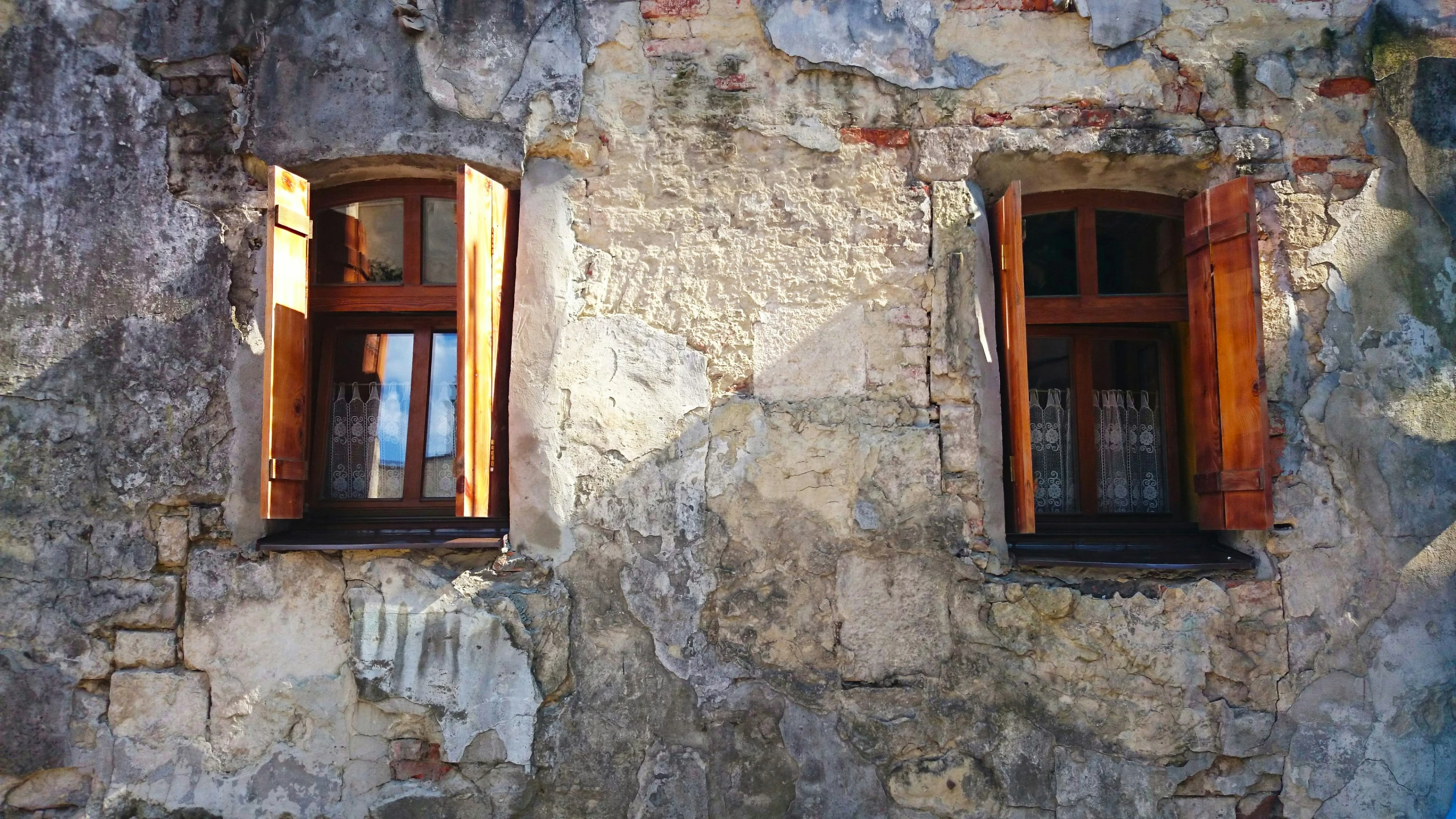 an old building with three windows on each window