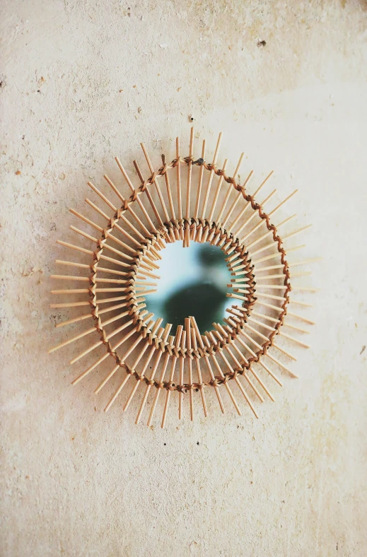 a round wooden object sitting on top of a cement surface