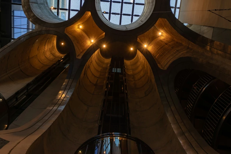 looking up at the circular windows on the roof of the building