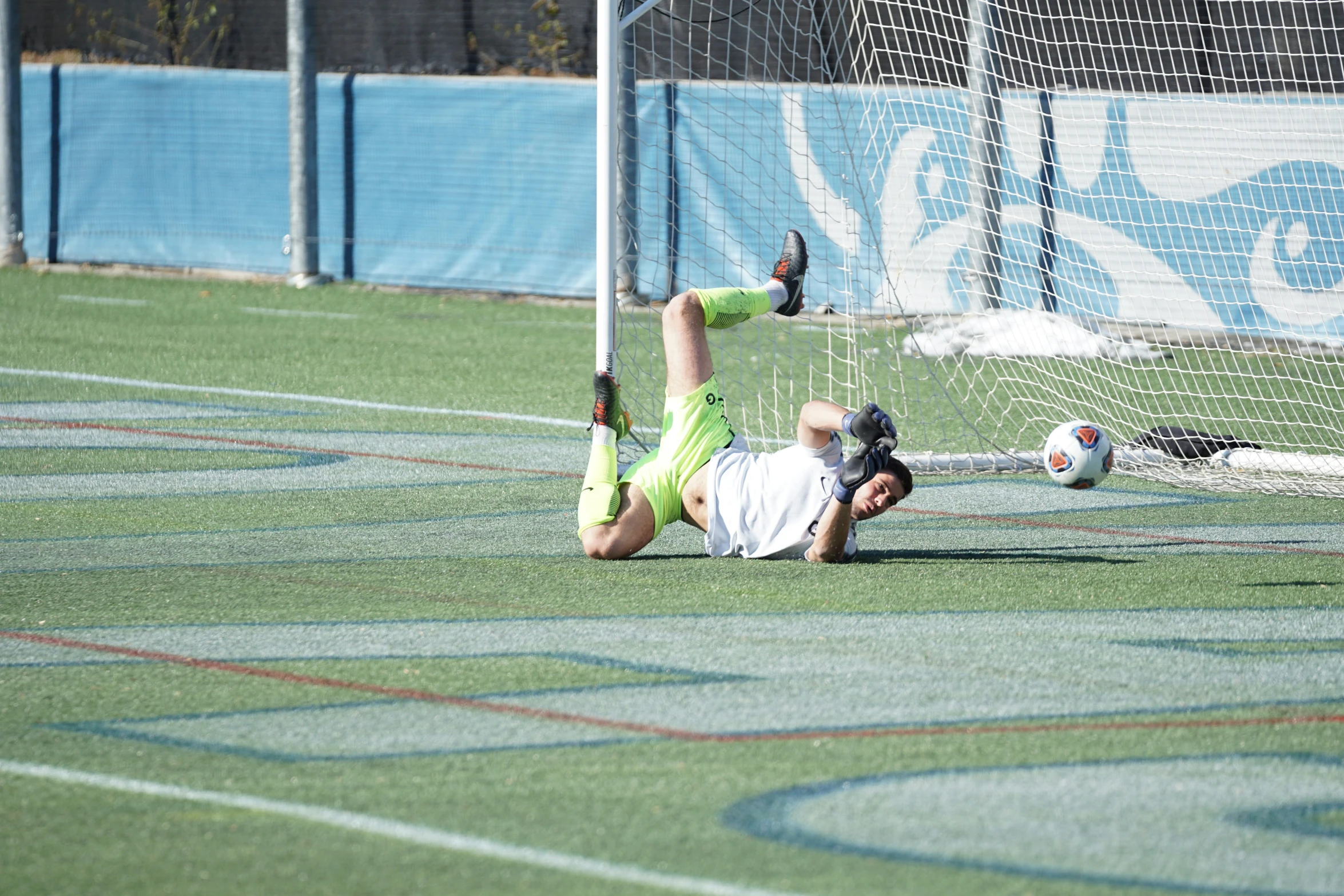 an athlete doing soing that looks like a goalie