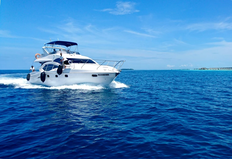 a white boat in the middle of the water