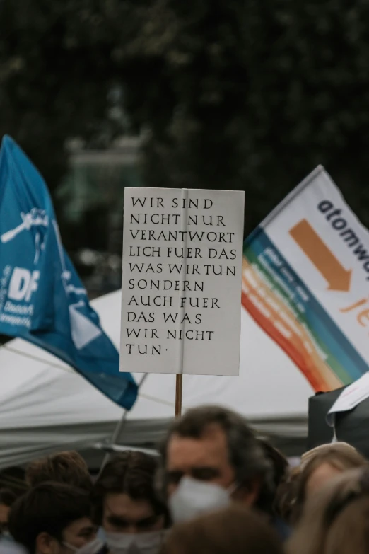 signs and people outside with flags on the side