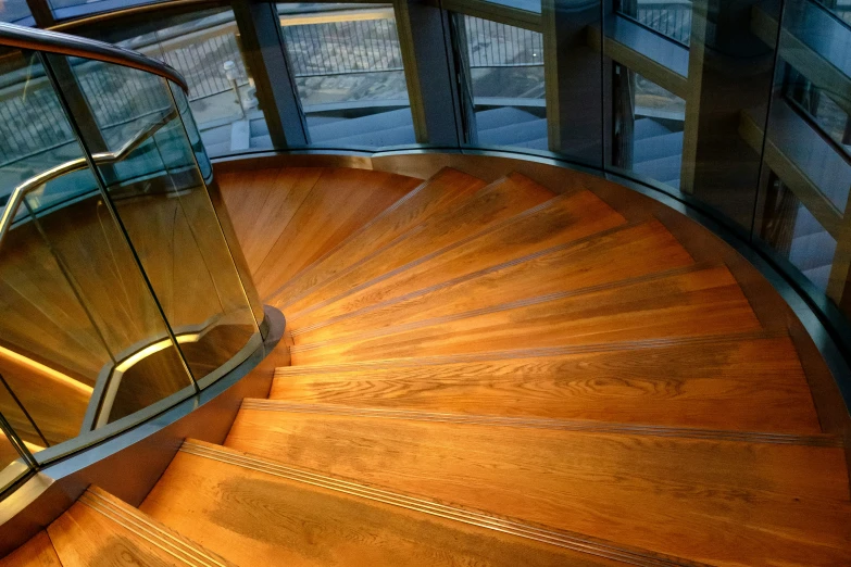 a view down a stairwell of a wooden floor