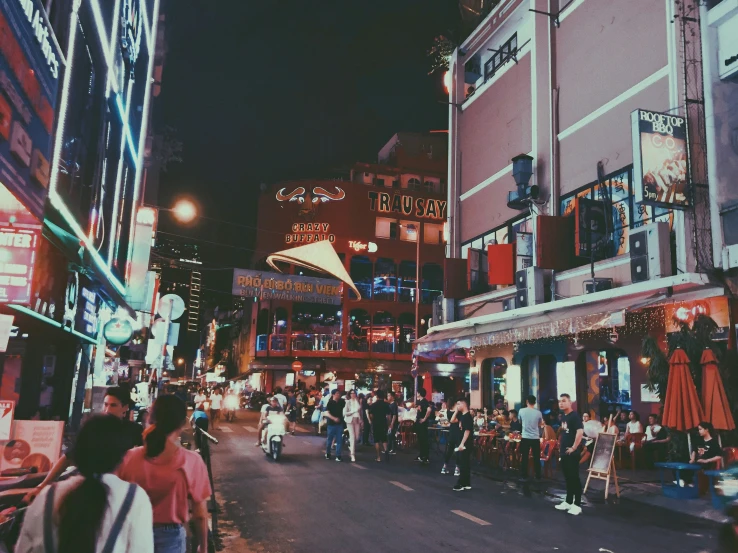 a couple of people standing in the middle of a street