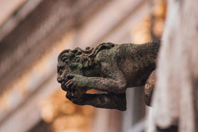 the figurine is sitting on the stone