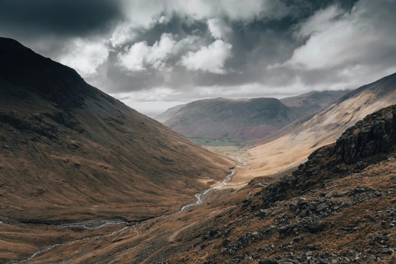 this is a valley with mountains in the background