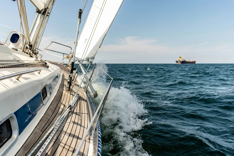 a large sailboat is in the middle of the ocean