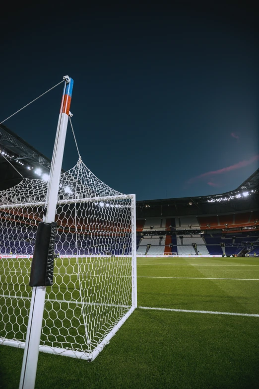a soccer ball on the goal at night