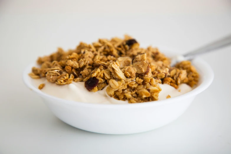 a spoon is in a bowl of food