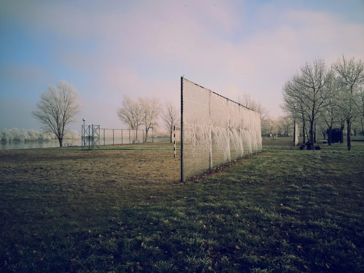 there is a large white wire structure in the grass