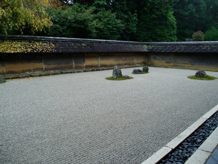 there are three statues placed on the courtyard