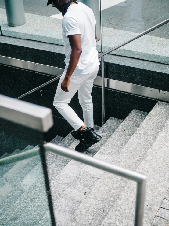 a man riding down some stairs on a skateboard