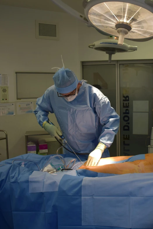 a surgeon is preparing to give  on a bed