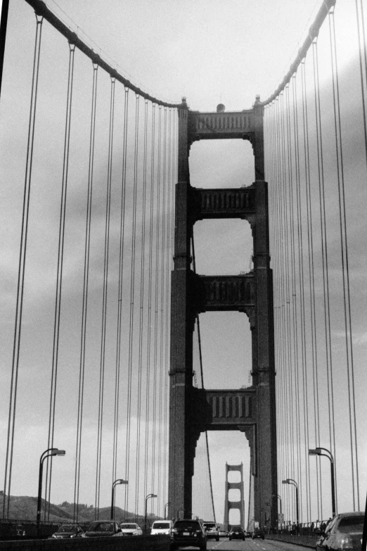 cars are driving across the golden gate bridge