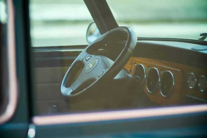 view from inside the vehicle of the front seat and dash board