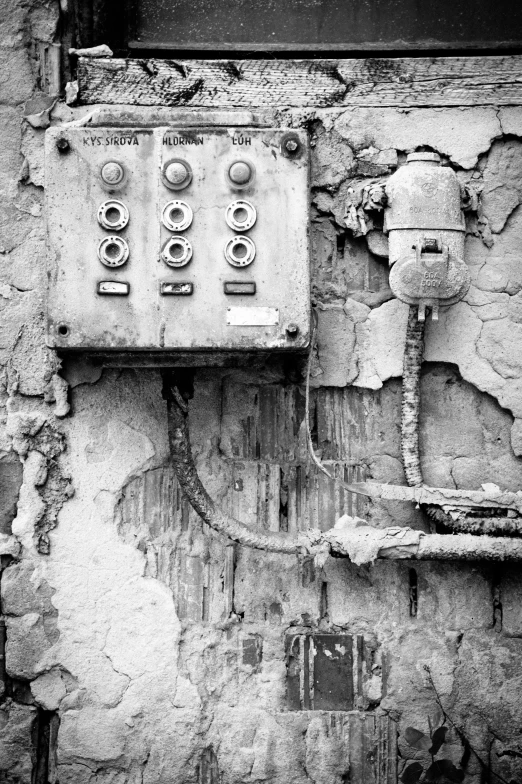 a control box on an old dilapidated building