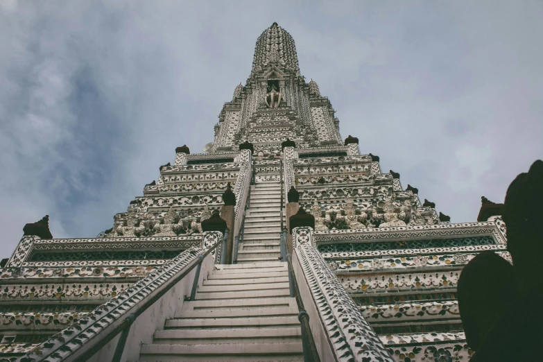 a very tall building with many stairs leading up