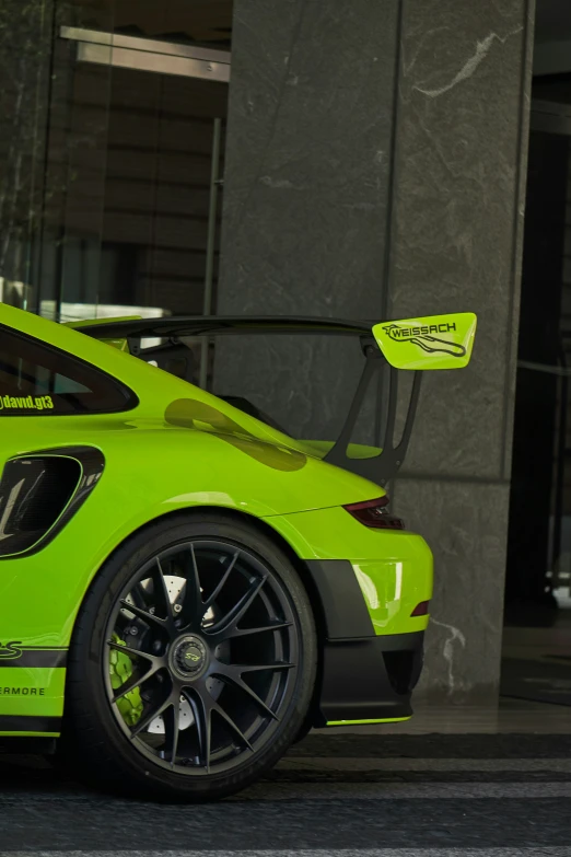 a close up of the front of a green sports car