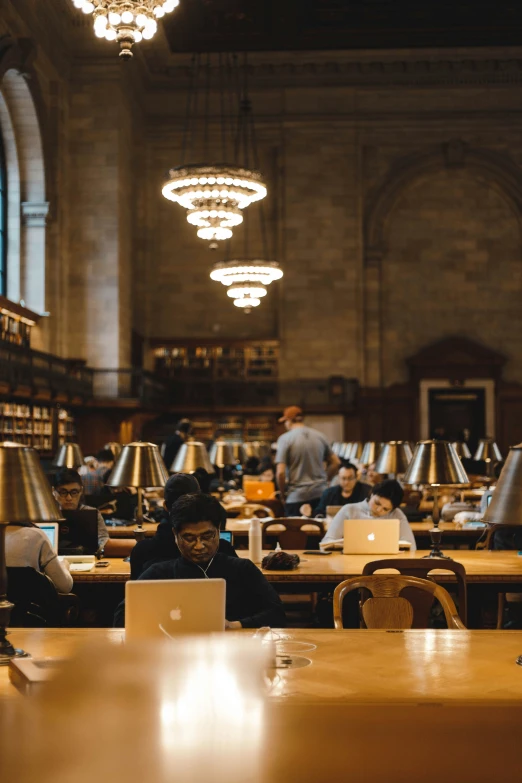 two people working at computers in a large room