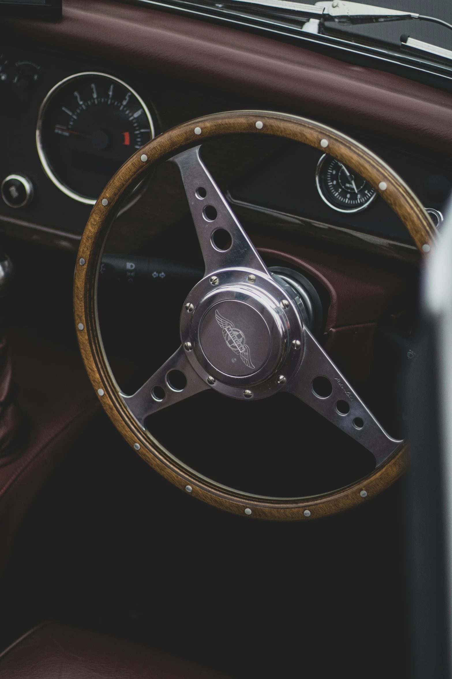 the dashboard and dashboard wheel of an old car