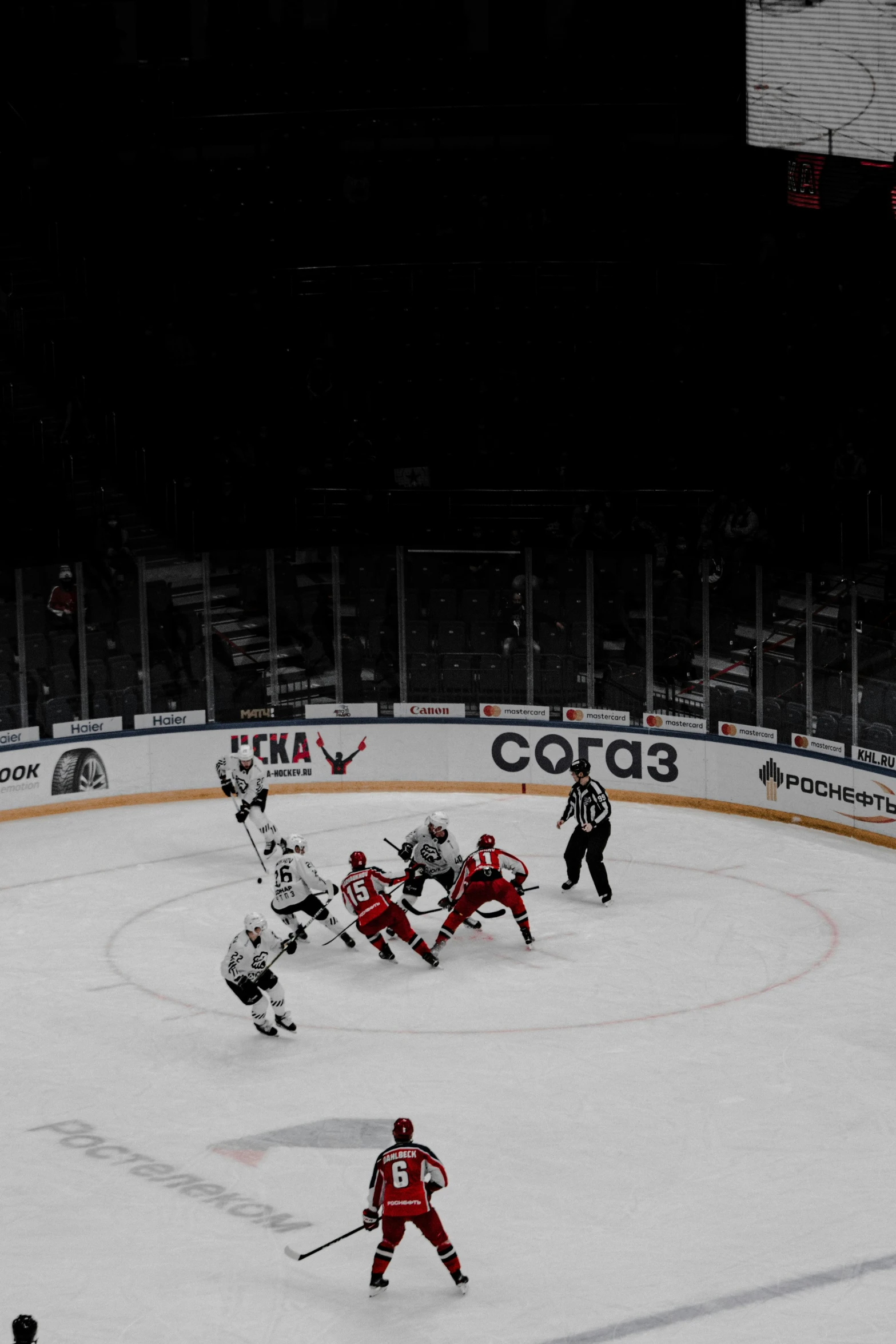 some players playing hockey in the dark