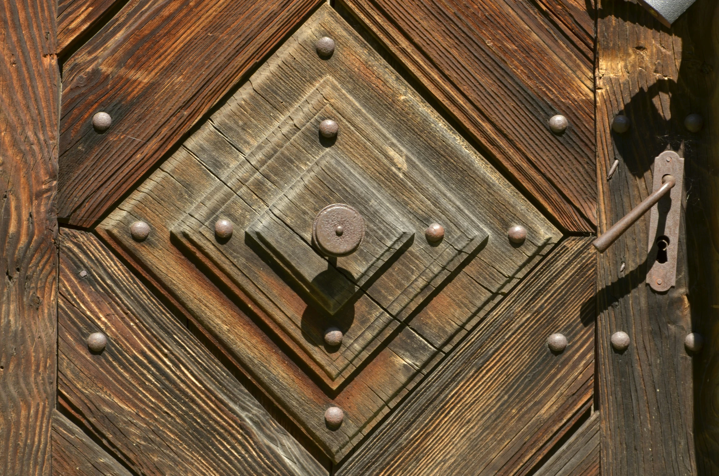 an open door with a metal  and small decorative decorations