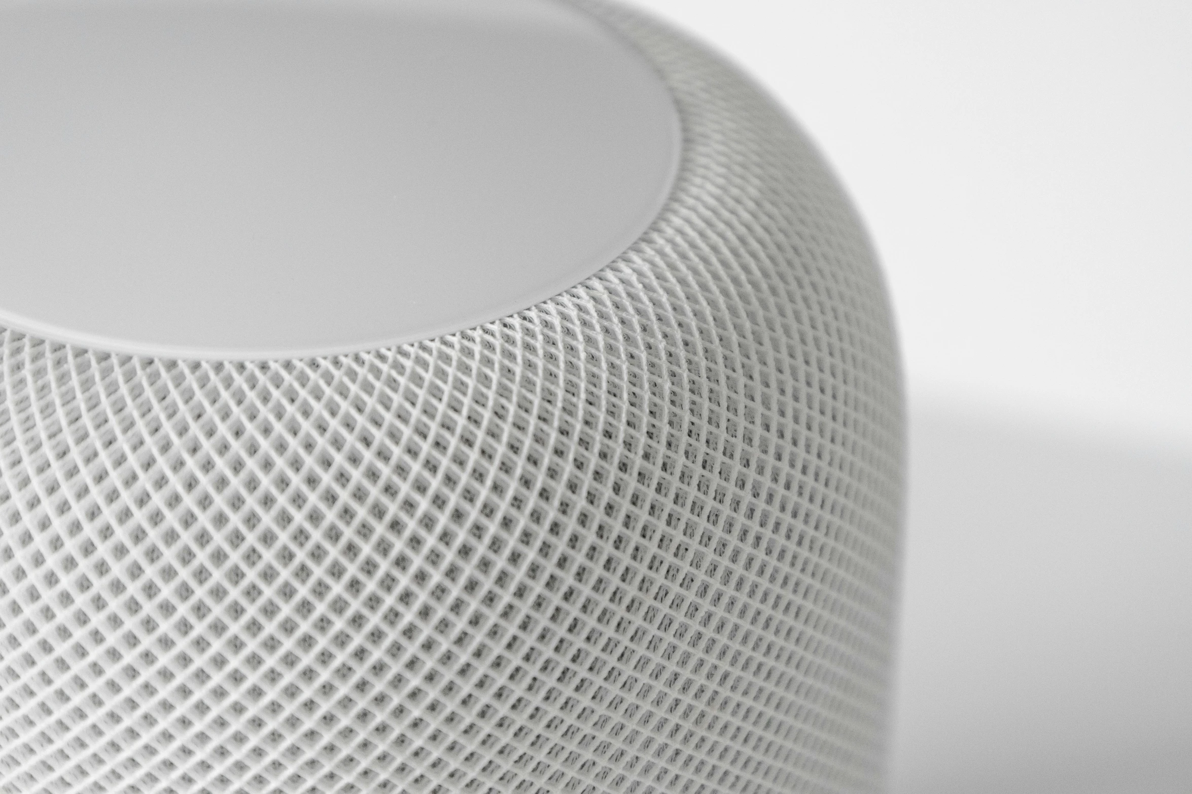 white colored, woven fabric skin on a modern speaker