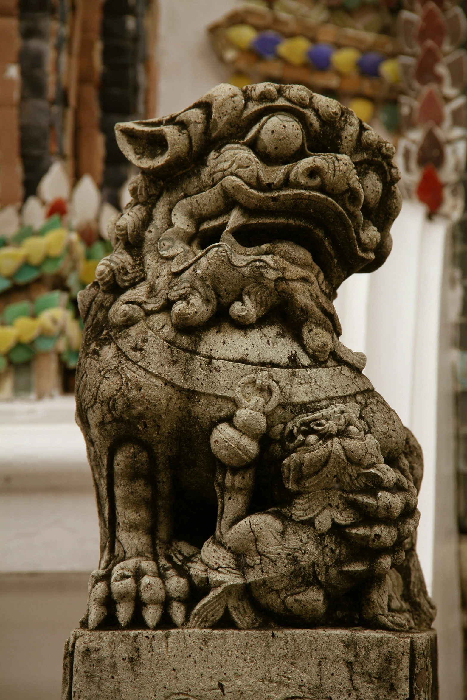 statue of animal with head turned away from camera