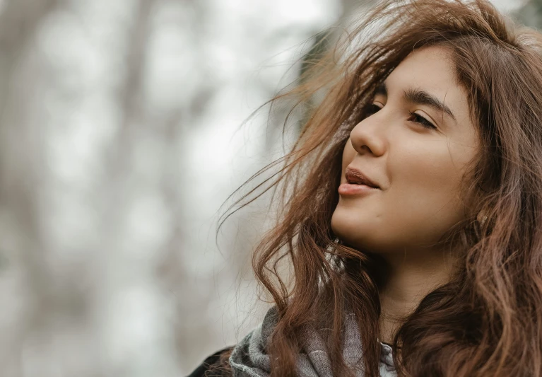 a close up of a woman with long hair