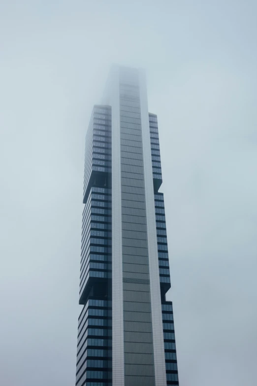 the top of a tall building with a few windows