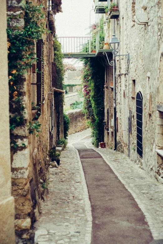 alley with stone walls and an open door