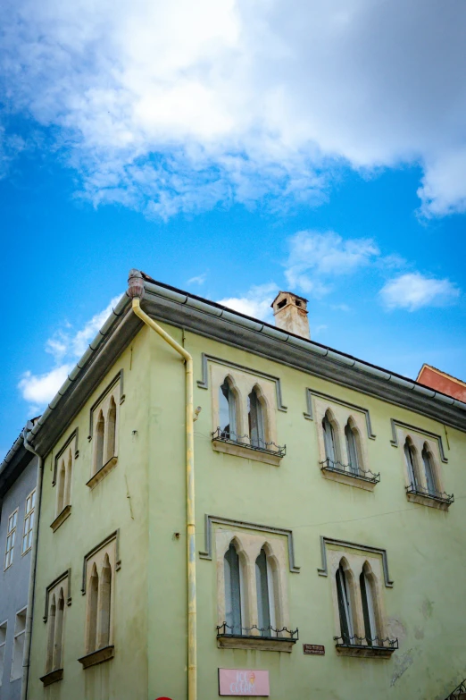 a building with multiple windows and a balcony