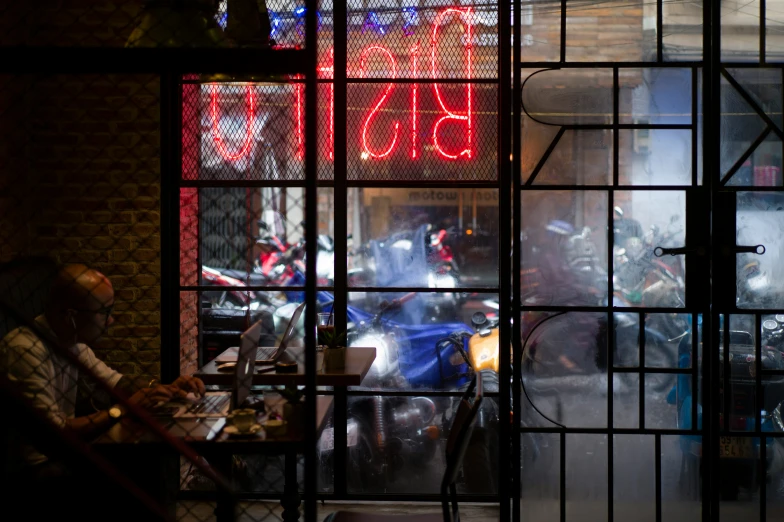 a view of an outdoor area through windows at night