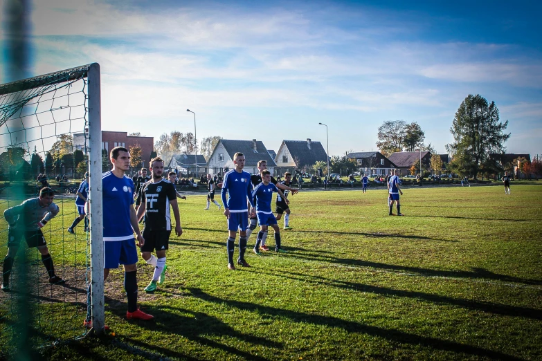 some s are playing soccer on a field