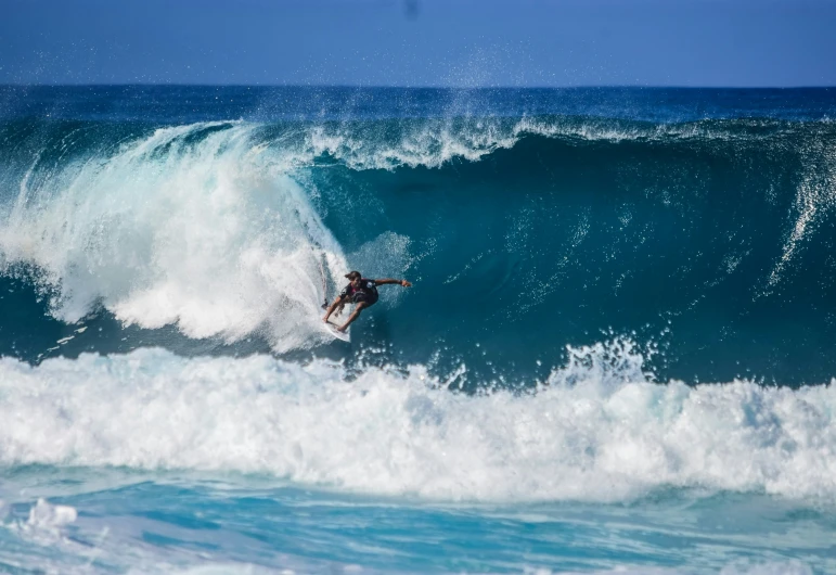 the surfer is catching a wave in the ocean