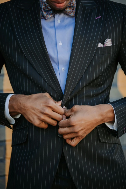 a man wearing a bow tie and a suit