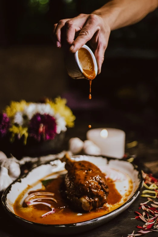 a close up of a plate of food with gravy on it